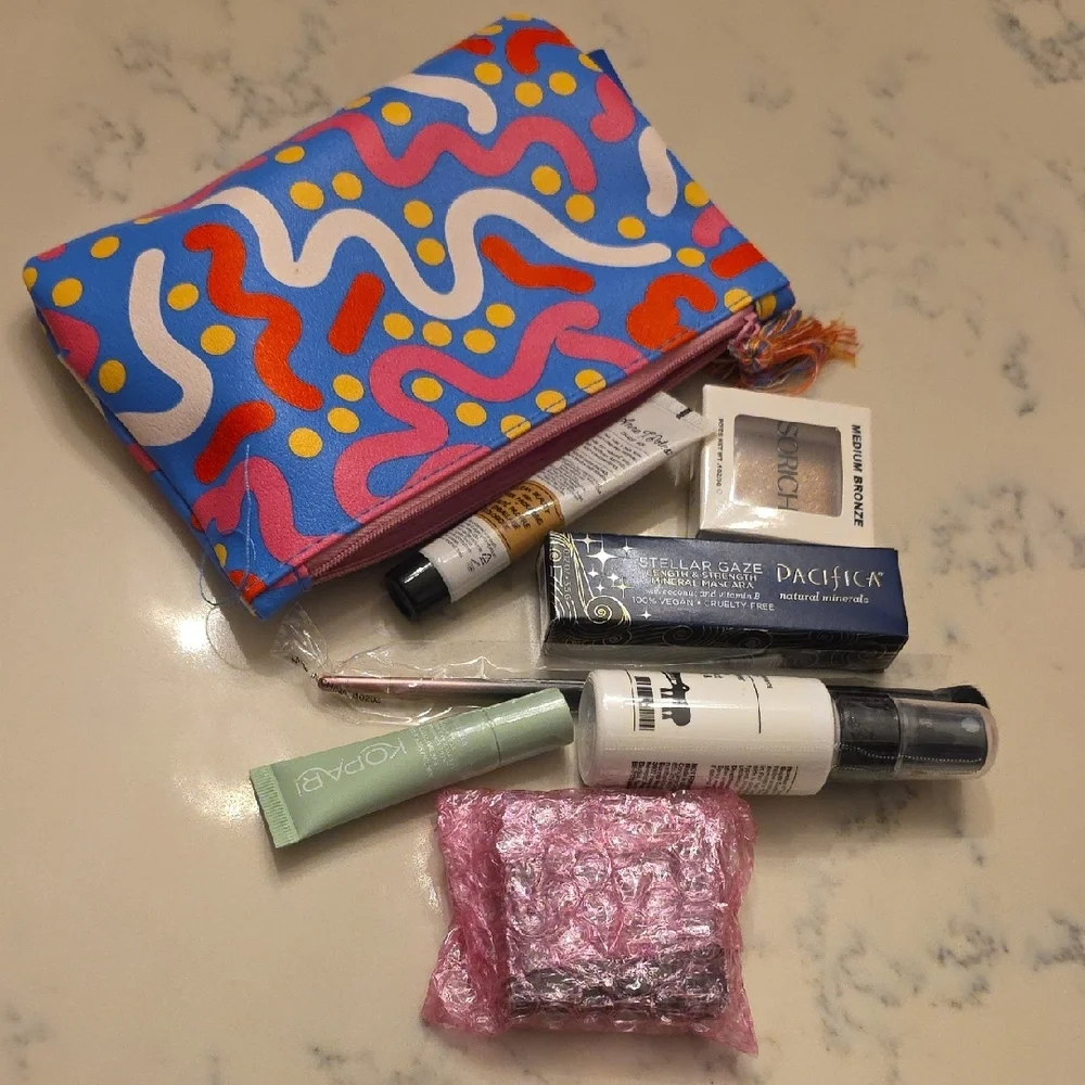 Colorful Patterned Makeup Bag with Assorted Beauty Products